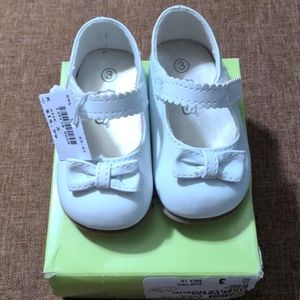 Infant shoes, white Patton leather with Velcro strap. Brand new, never worn.